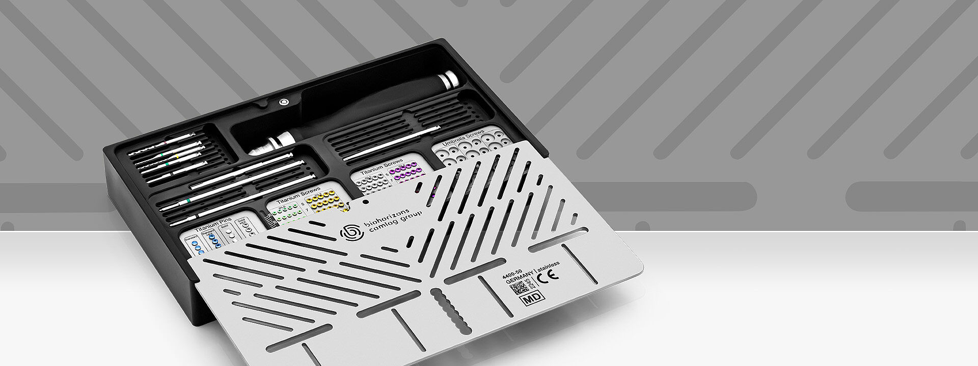 dev-os toolbox filled with bone fixation and membrane stabilization instruments in fron of grey background.